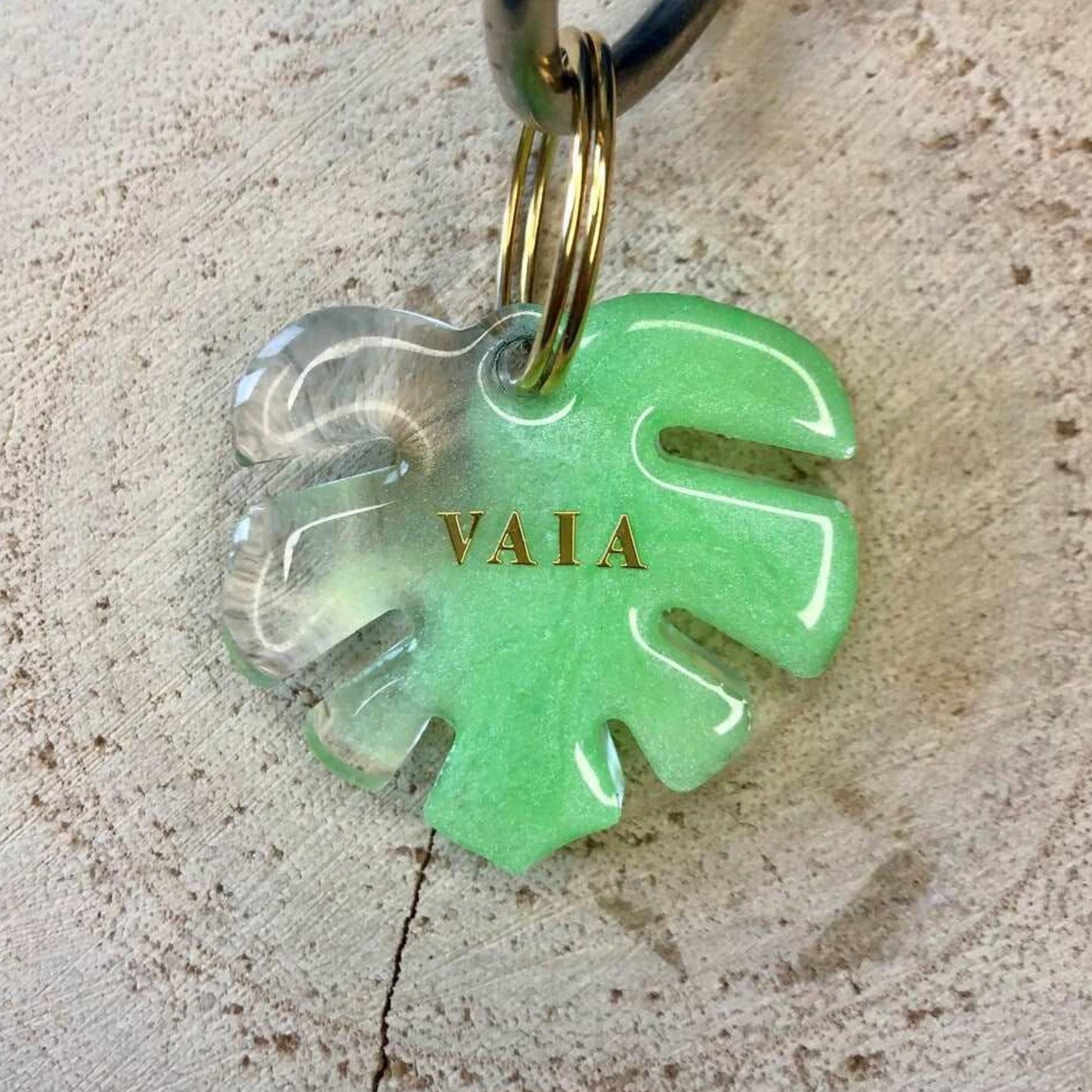Transparent green dog tag